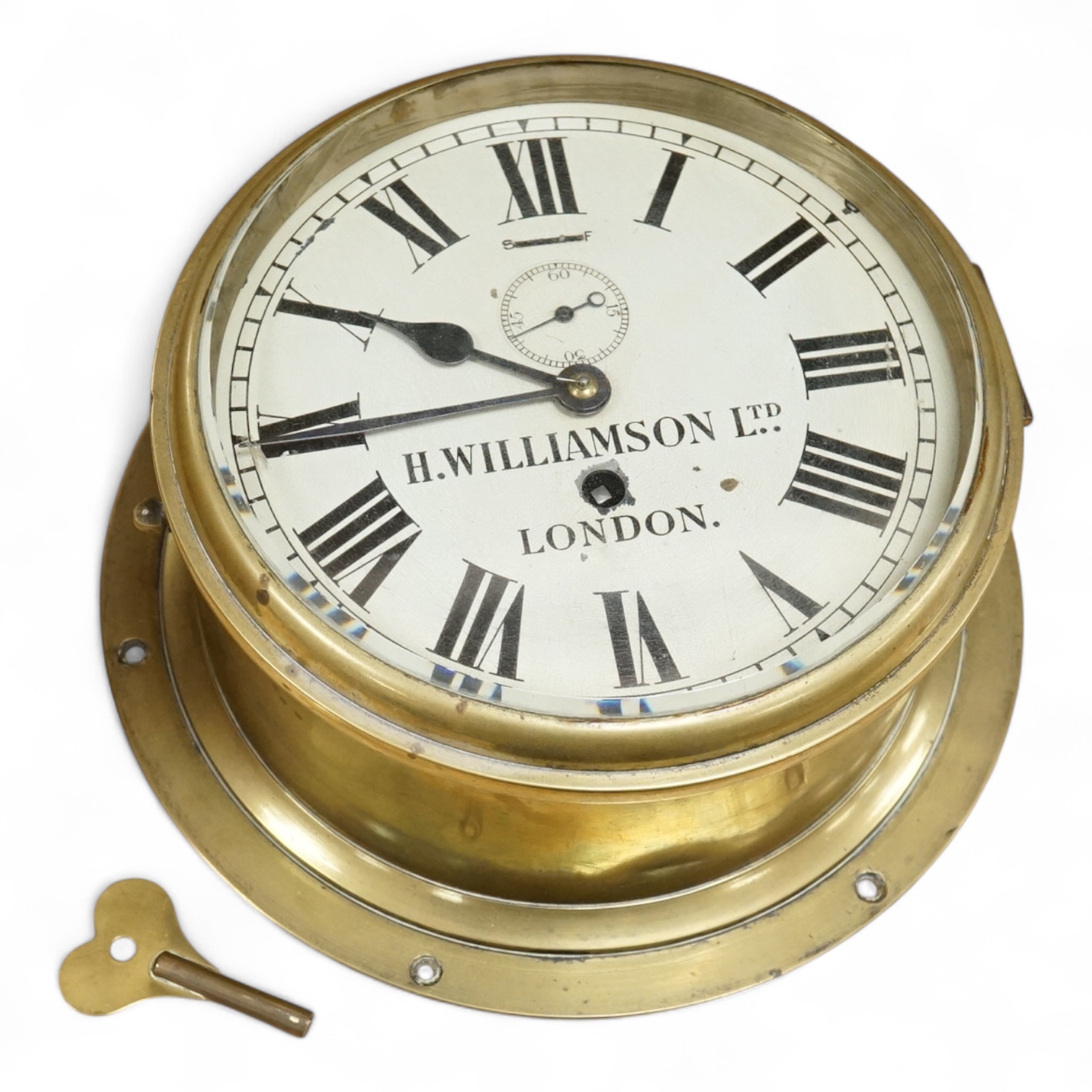 H Williamson Ltd, London, brass ships bulkhead timepiece with key, 28cm in diameter